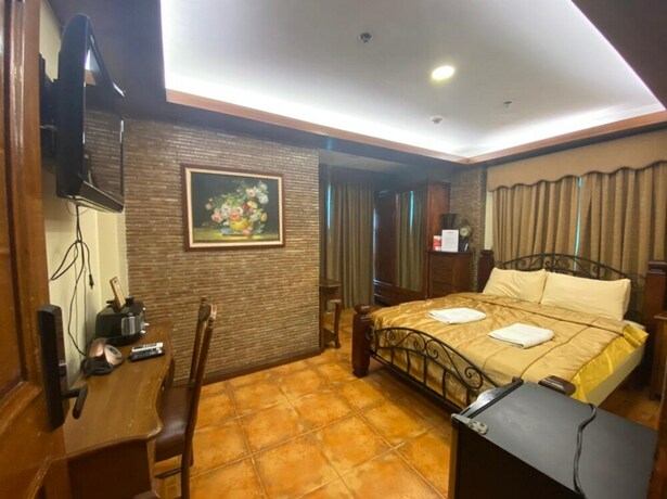 Imagen de la habitación del Hotel Oyo 797 Brickwood Suites. Foto 6