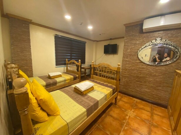 Imagen de la habitación del Hotel Oyo 797 Brickwood Suites. Foto 7