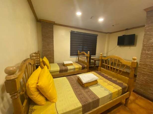 Imagen de la habitación del Hotel Oyo 797 Brickwood Suites. Foto 8