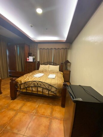 Imagen de la habitación del Hotel Oyo 797 Brickwood Suites. Foto 9