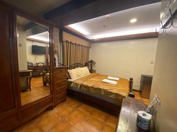 Imagen de la habitación del Hotel Oyo 797 Brickwood Suites. Foto 10