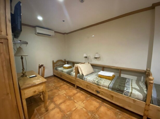 Imagen de la habitación del Hotel Oyo 797 Brickwood Suites. Foto 11