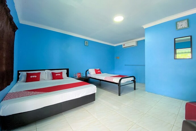 Imagen de la habitación del Hotel Oyo 90168 Serambi Pelangi Chalet. Foto 24
