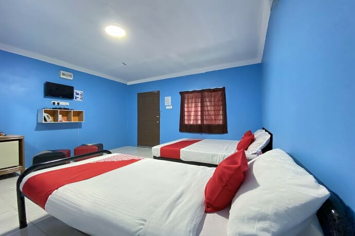 Imagen de la habitación del Hotel Oyo 90168 Serambi Pelangi Chalet. Foto 27