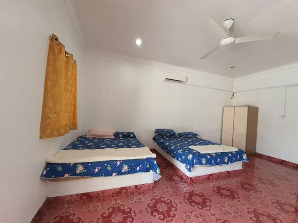 Imagen de la habitación del Hotel Oyo 90302 Dimuara Chalet Tok Bali. Foto 5