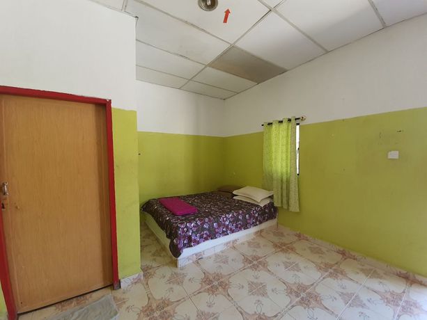 Imagen de la habitación del Hotel Oyo 90302 Dimuara Chalet Tok Bali. Foto 7