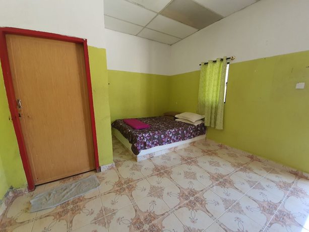 Imagen de la habitación del Hotel Oyo 90302 Dimuara Chalet Tok Bali. Foto 9