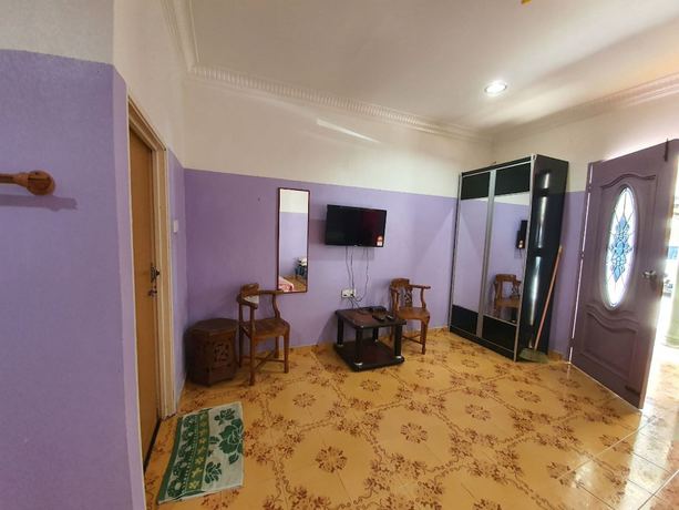 Imagen de la habitación del Hotel Oyo 90302 Dimuara Chalet Tok Bali. Foto 10