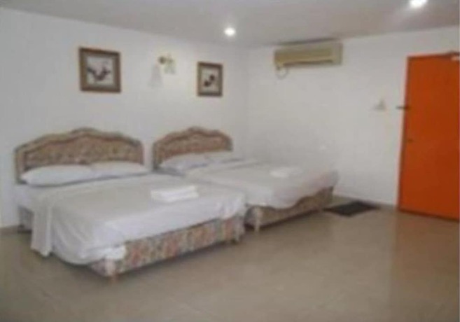 Imagen de la habitación del Hotel Oyo 90494 Sam Huat. Foto 2