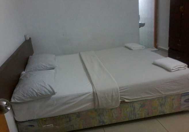 Imagen de la habitación del Hotel Oyo 90494 Sam Huat. Foto 6