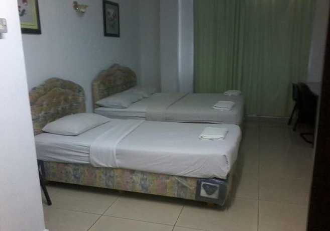 Imagen de la habitación del Hotel Oyo 90494 Sam Huat. Foto 7