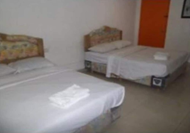 Imagen de la habitación del Hotel Oyo 90494 Sam Huat. Foto 12