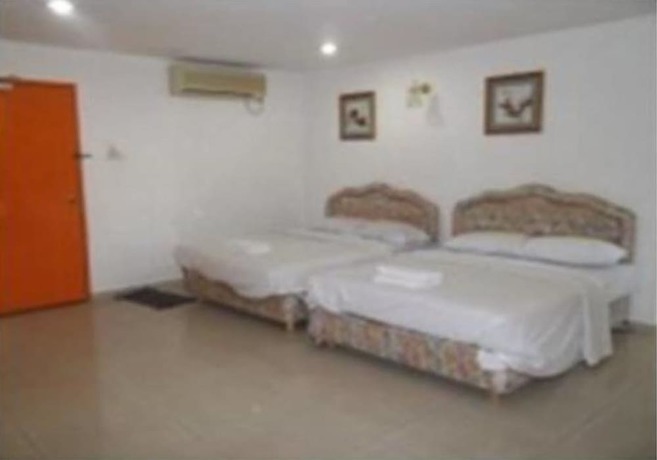 Imagen de la habitación del Hotel Oyo 90494 Sam Huat. Foto 15