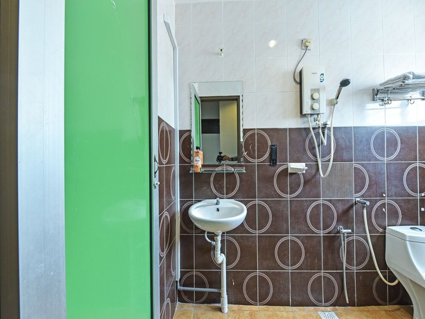 Imagen de la habitación del Hotel Oyo 90644 M Three. Foto 4