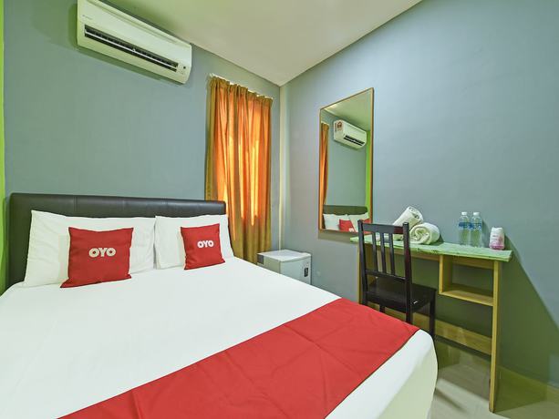 Imagen de la habitación del Hotel Oyo 90703 Rim Global. Foto 13