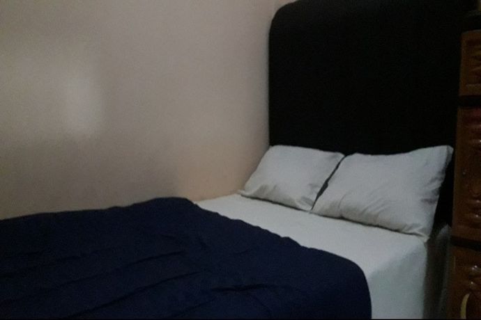 Imagen de la habitación del Hotel Oyo 90706 Kost Alam Jaya Syariah. Foto 6