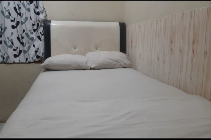 Imagen de la habitación del Hotel Oyo 90706 Kost Alam Jaya Syariah. Foto 7