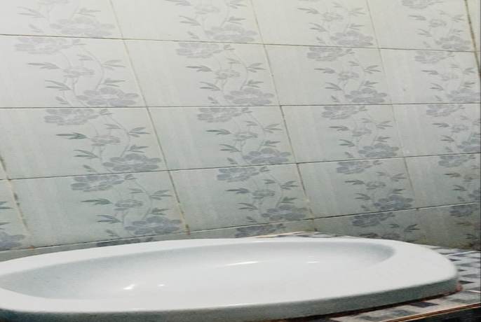 Imagen de la habitación del Hotel Oyo 90706 Kost Alam Jaya Syariah. Foto 8
