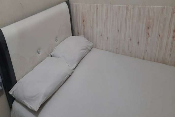 Imagen de la habitación del Hotel Oyo 90706 Kost Alam Jaya Syariah. Foto 9