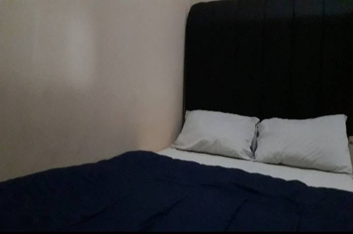 Imagen de la habitación del Hotel Oyo 90706 Kost Alam Jaya Syariah. Foto 10