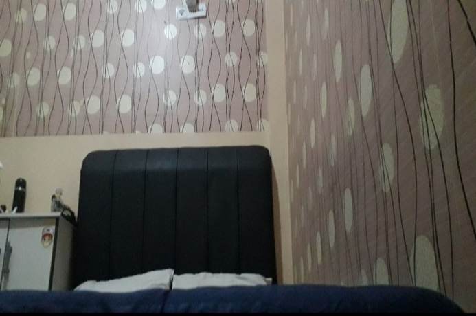 Imagen de la habitación del Hotel Oyo 90706 Kost Alam Jaya Syariah. Foto 13