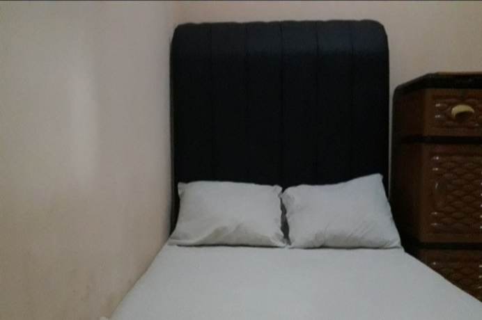 Imagen de la habitación del Hotel Oyo 90706 Kost Alam Jaya Syariah. Foto 14