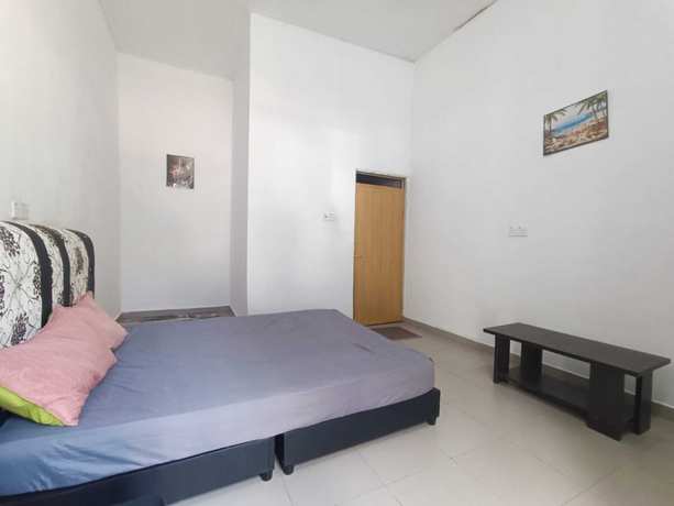 Imagen de la habitación del Hotel Oyo 90799 Sharhan Residence. Foto 3