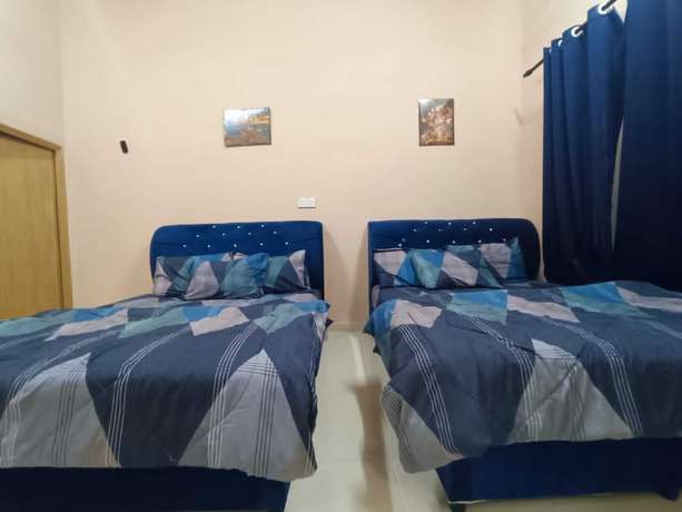 Imagen de la habitación del Hotel Oyo 90799 Sharhan Residence. Foto 6
