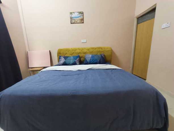 Imagen de la habitación del Hotel Oyo 90799 Sharhan Residence. Foto 11
