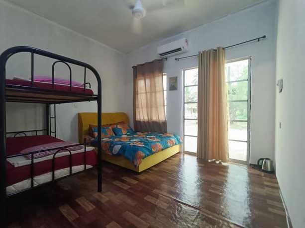 Imagen de la habitación del Hotel Oyo 90799 Sharhan Residence. Foto 12