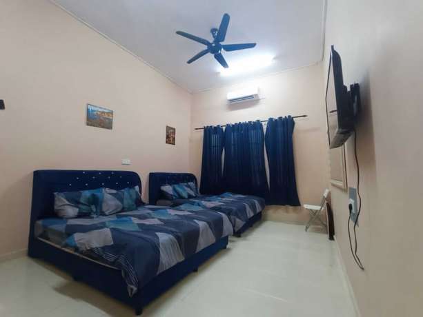 Imagen de la habitación del Hotel Oyo 90799 Sharhan Residence. Foto 14