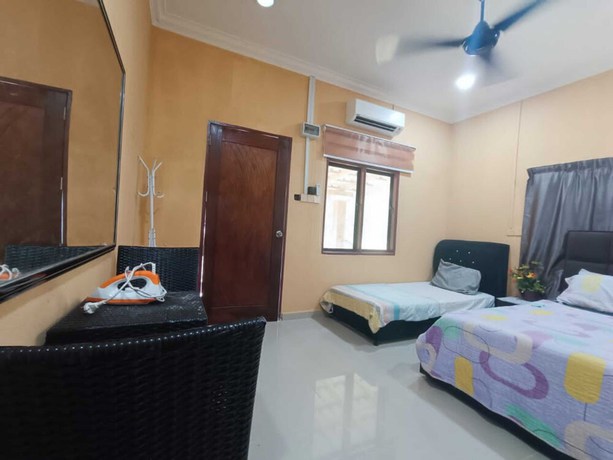 Imagen de la habitación del Hotel Oyo 90799 Sharhan Residence. Foto 17