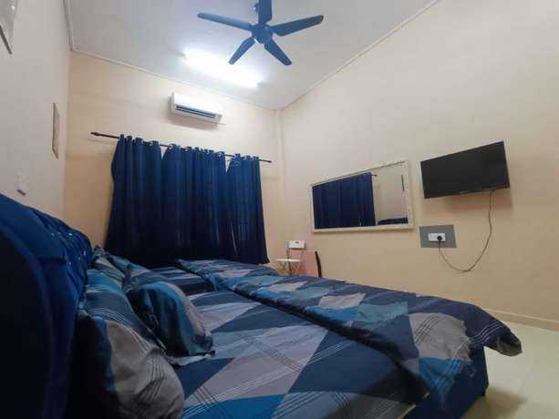 Imagen de la habitación del Hotel Oyo 90799 Sharhan Residence. Foto 18