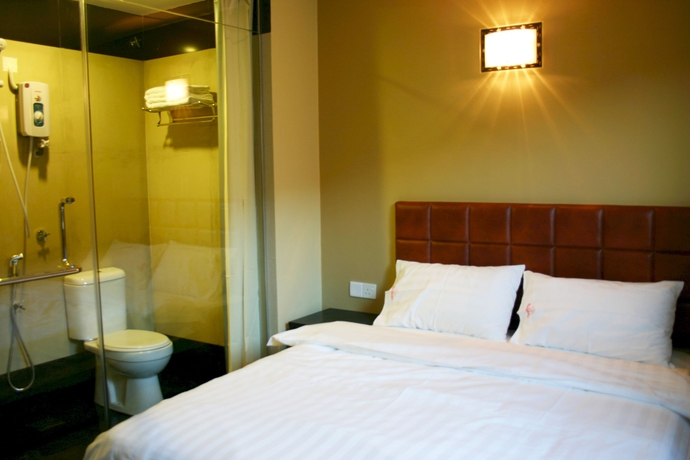 Imagen de la habitación del Hotel Oyo 90865 De Nice Inn. Foto 2