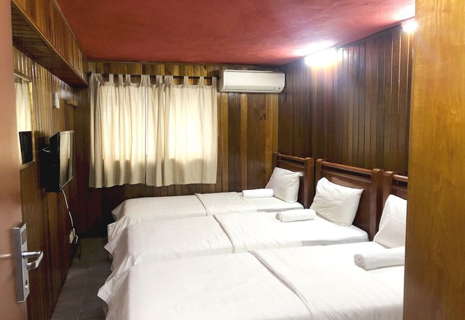 Imagen de la habitación del Hotel Oyo 90909 I.villa Inn. Foto 6
