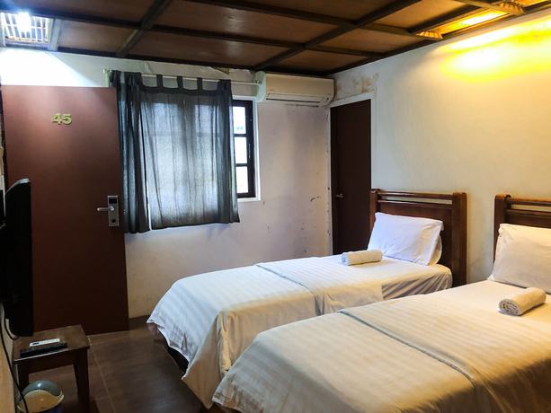 Imagen de la habitación del Hotel Oyo 90909 I.villa Inn. Foto 9