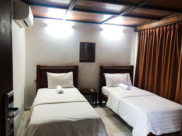Imagen de la habitación del Hotel Oyo 90909 I.villa Inn. Foto 11