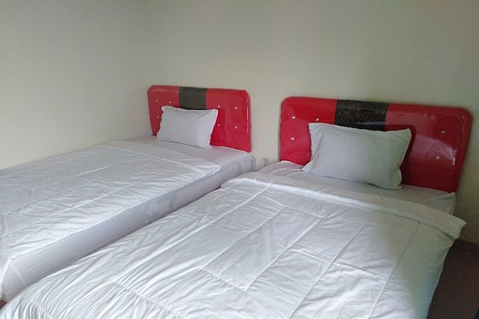 Imagen de la habitación del Hotel Oyo 90930 Wisma Hana Hani. Foto 5