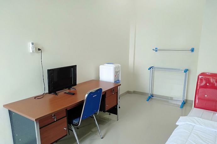 Imagen de la habitación del Hotel Oyo 90930 Wisma Hana Hani. Foto 6