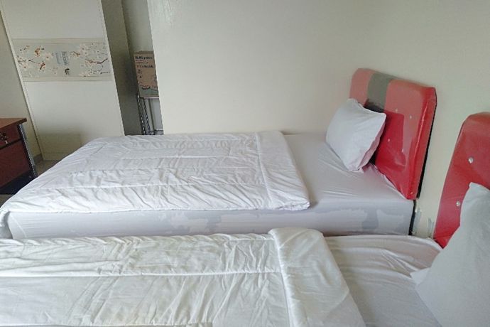 Imagen de la habitación del Hotel Oyo 90930 Wisma Hana Hani. Foto 7