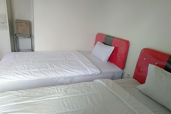 Imagen de la habitación del Hotel Oyo 90930 Wisma Hana Hani. Foto 10