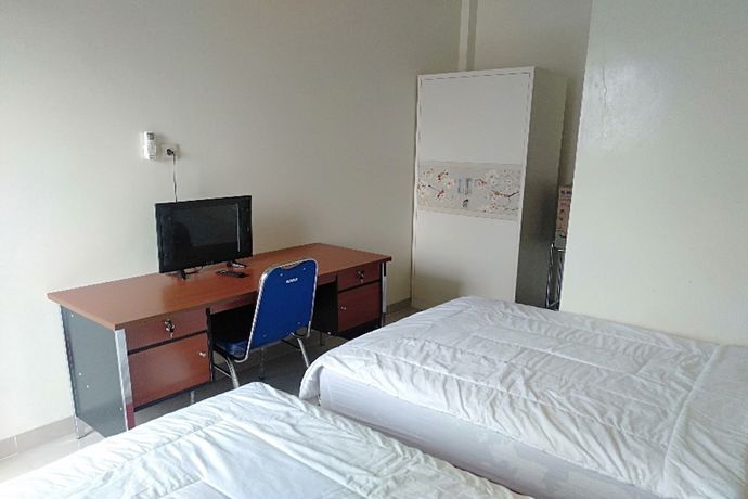 Imagen de la habitación del Hotel Oyo 90930 Wisma Hana Hani. Foto 13