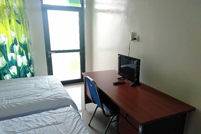 Imagen de la habitación del Hotel Oyo 90930 Wisma Hana Hani. Foto 14