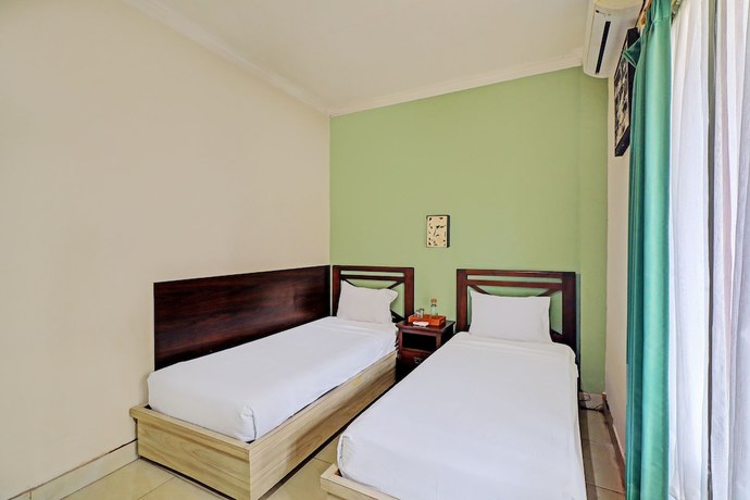Imagen de la habitación del Hotel Oyo 92439 Tower Klungkung. Foto 4
