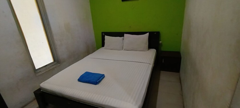 Imagen de la habitación del Hotel Oyo 93295 Wisma Aluh Ambak. Foto 5