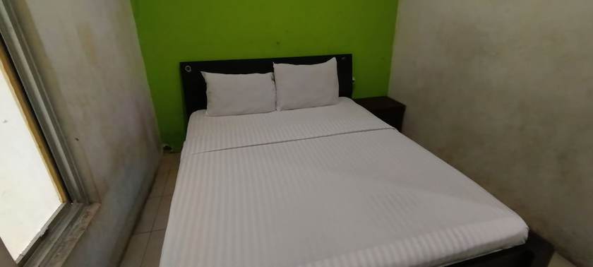 Imagen de la habitación del Hotel Oyo 93295 Wisma Aluh Ambak. Foto 6