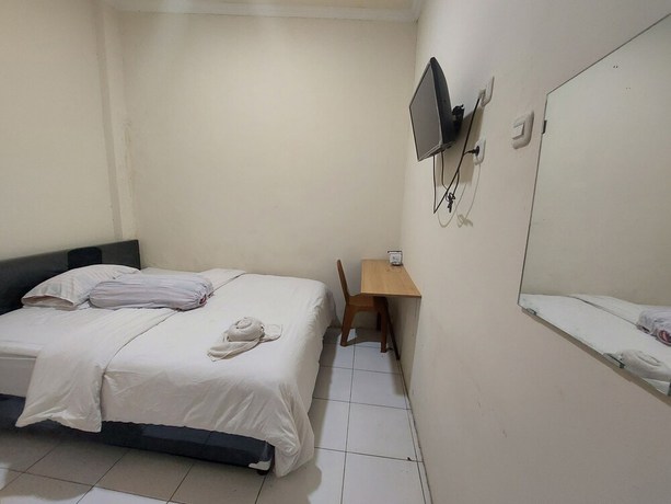 Imagen de la habitación del Hotel Oyo 93332 Kharis Home Stay. Foto 5