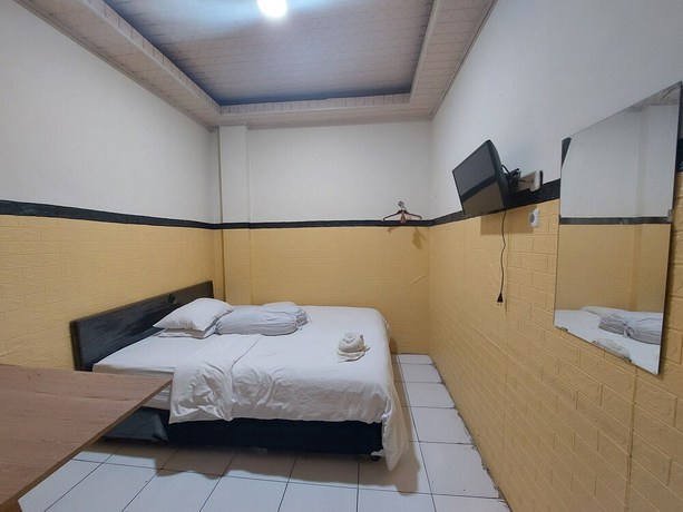 Imagen de la habitación del Hotel Oyo 93332 Kharis Home Stay. Foto 6