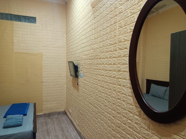 Imagen de la habitación del Hotel Oyo 93333 Rama Home Stay. Foto 7