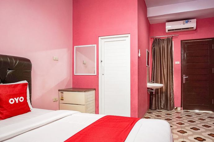 Imagen de la habitación del Hotel Oyo 93342 Yasmine Guesthouse Syariah. Foto 12